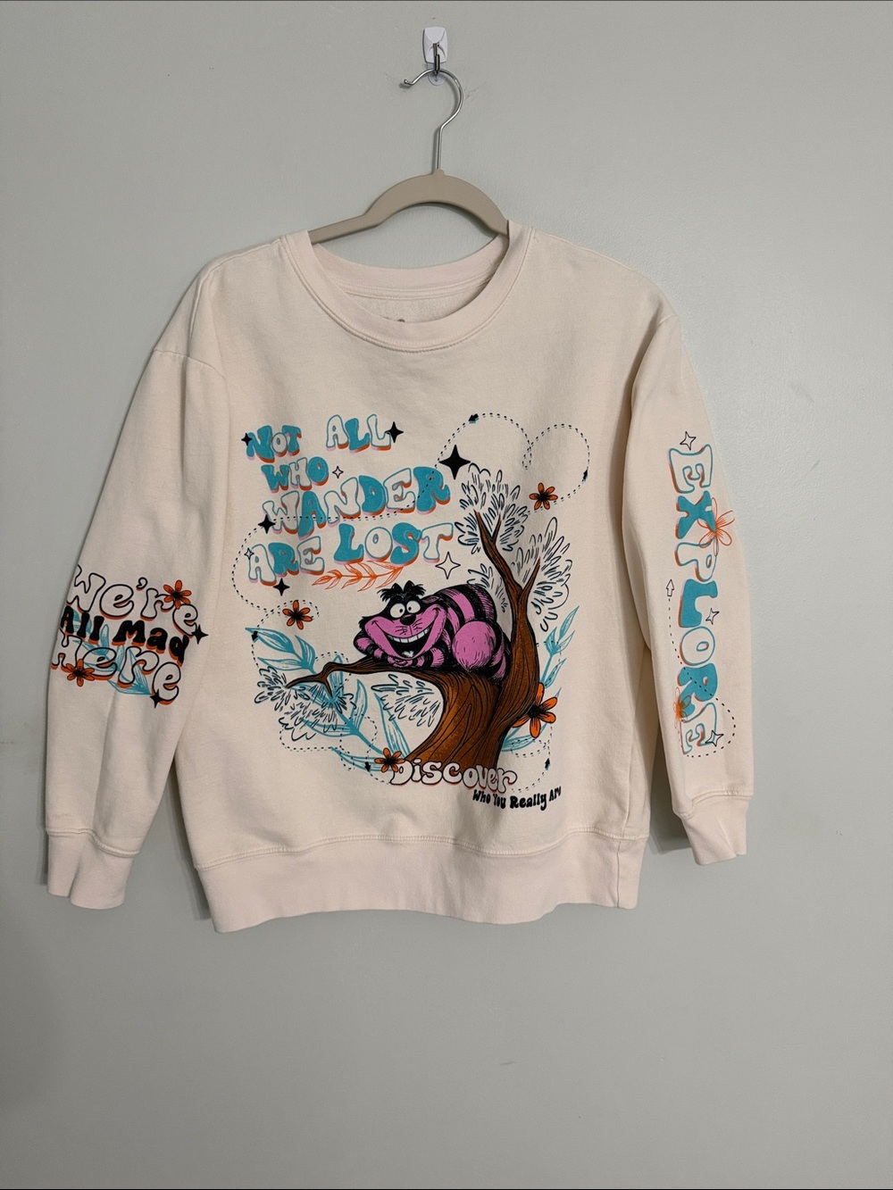 Disney Cream Crewneck Sweatshirt with Pink Cheshire Cat Graphic